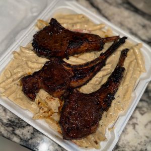 Jerk Lamb Chop Rasta pasta with garlic butter croissants