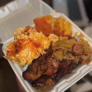 Jerk chicken with fried cabbage , Mac n cheese & honey cornbread