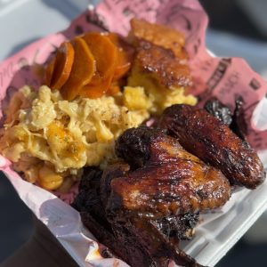 Jerk Chicken with Mac n Cheese, Candied yams and honey cornbread
